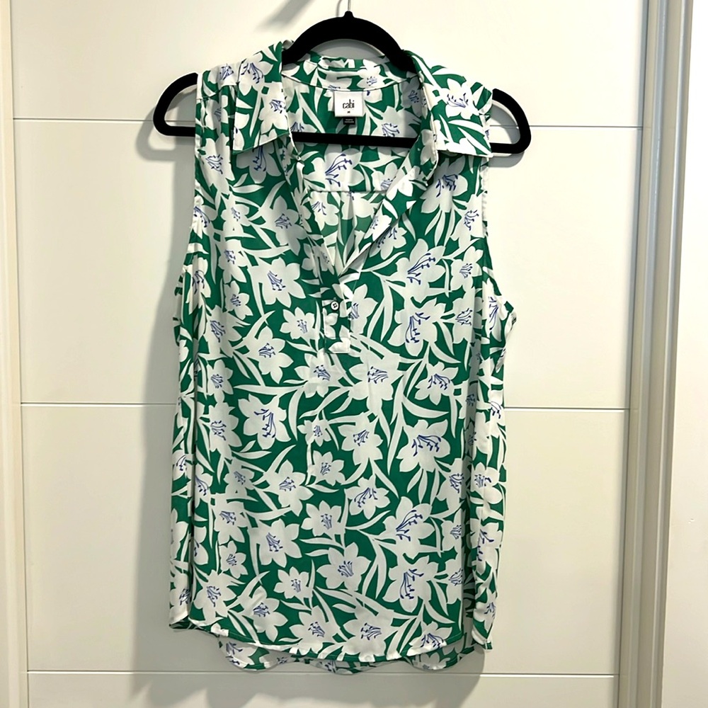 CAbi blue, green and white flowered sleeveless shirt with single button front.☀️